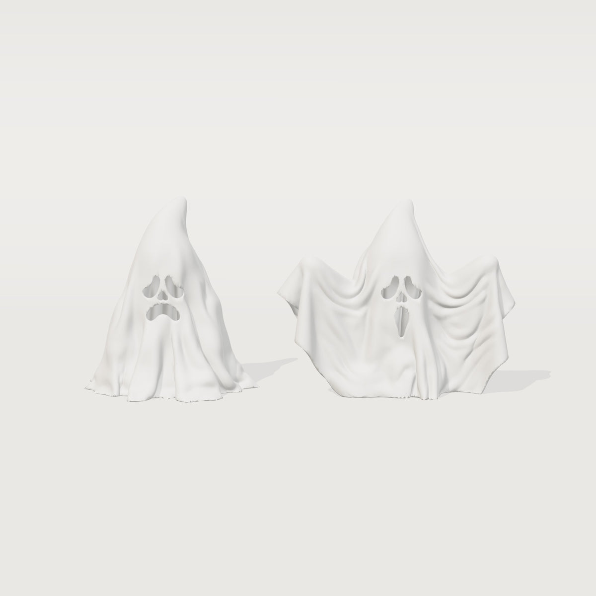 Two white 3D printed ghost figurines with hollow faces, front view